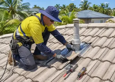 Roofer carrying out a roof leak repair around a roof penetration