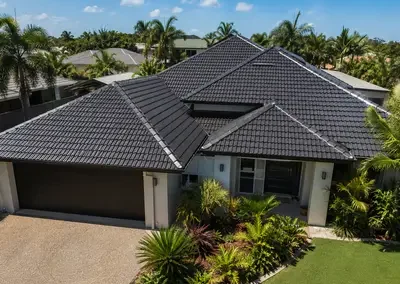 Completed tiled roof restoration with a clean dark finish